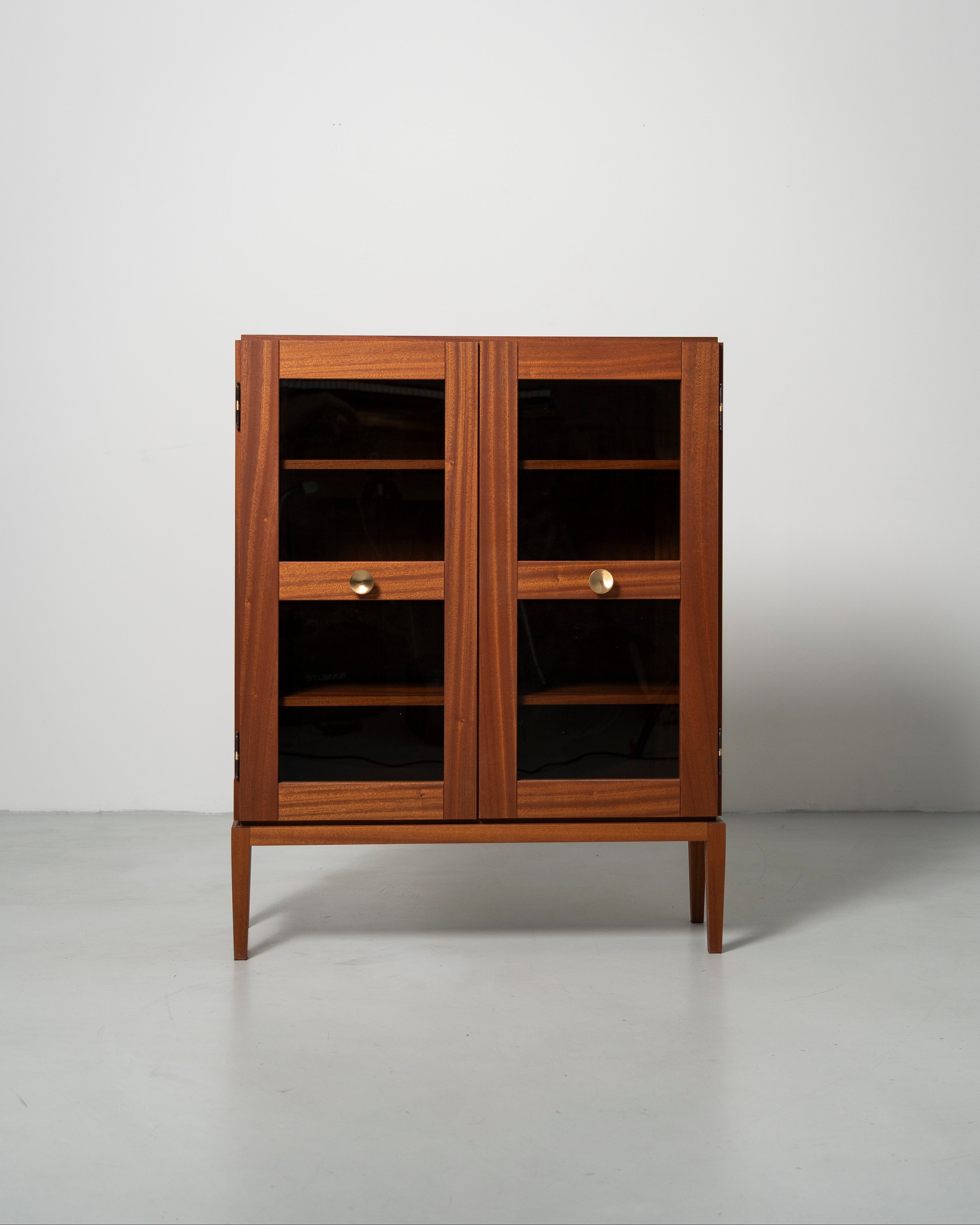 PH Display Cabinet by Poul Henningsen, Danish design classic (1930s)
mahogany cabinet with glass doors and brass handles