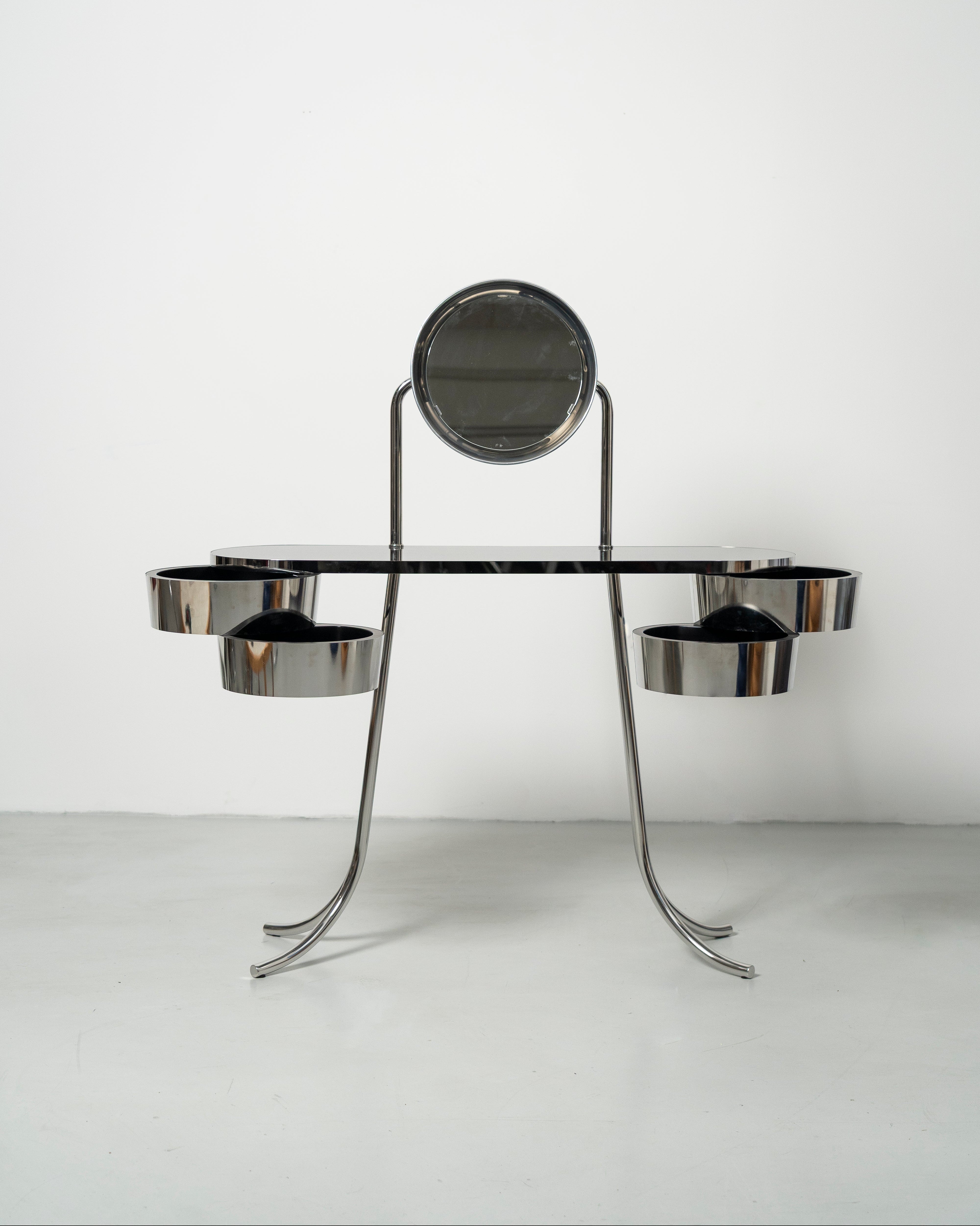 PH Dressing Table Steel by Poul Henningsen, Danish design classic (1919)
steel tube dressing table with two cylindrical containers with drawers and PH Mirror lamp