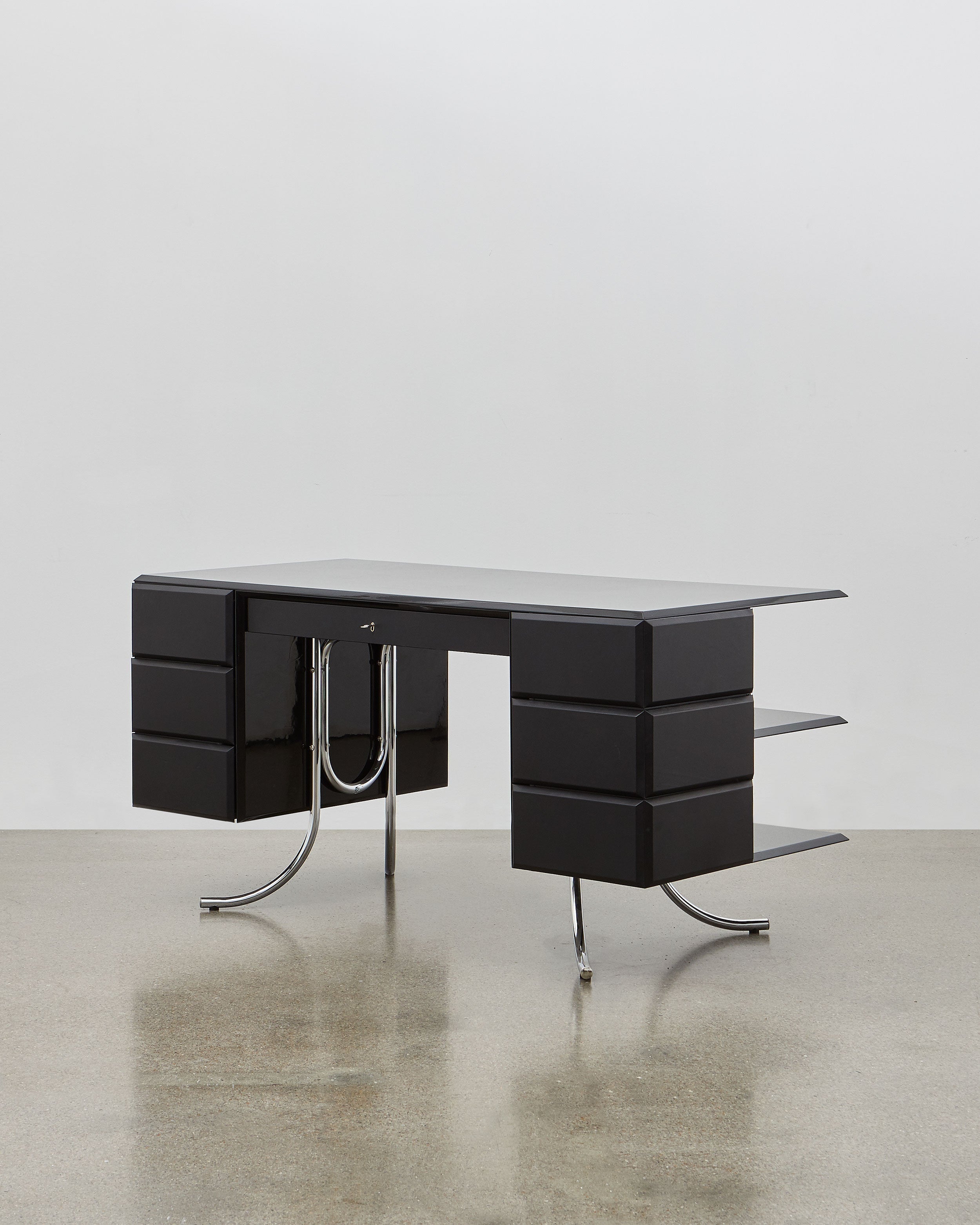 PH Office Desk by Poul Henningsen, Danish design classic (1930s)
A sleek black office desk with high gloss finish, six leather swing drawers, and chromed legs, designed by Poul Henningsen.