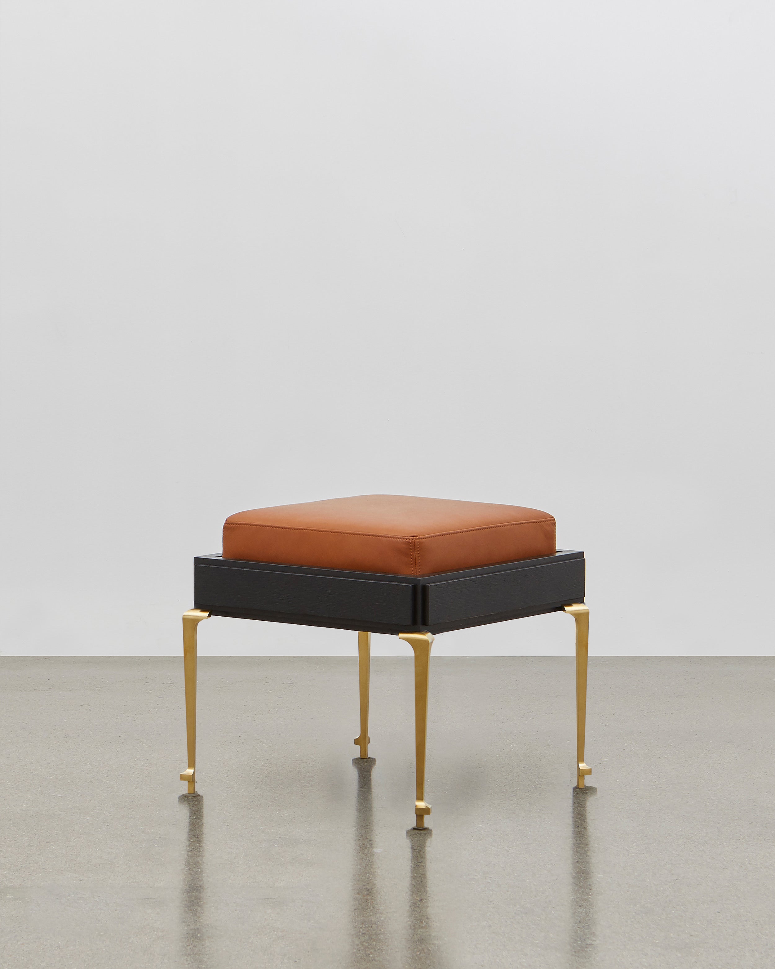 PH Stool by Poul Henningsen, Danish design classic (1920) A walnut upholstered stool standing on four brass legs