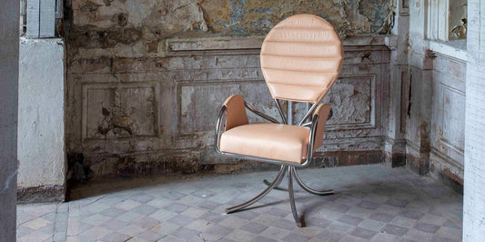 The PH Pope Chair in undyed natural leather designed by Poul Henningsen