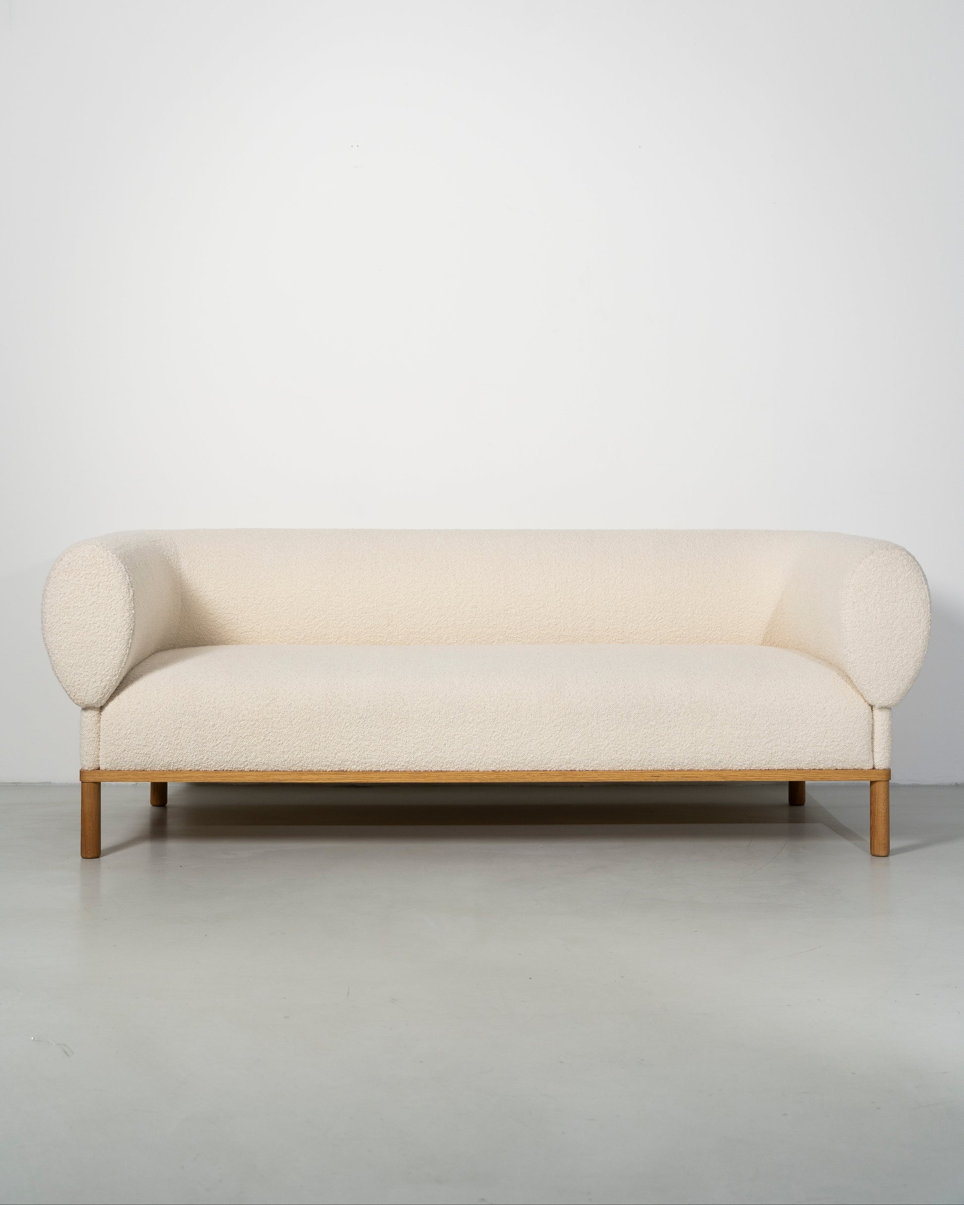 Gallant Sofa by Morten & Jonas, contemporary Scandinavian design, Modern white boucle sofa with wooden frame 