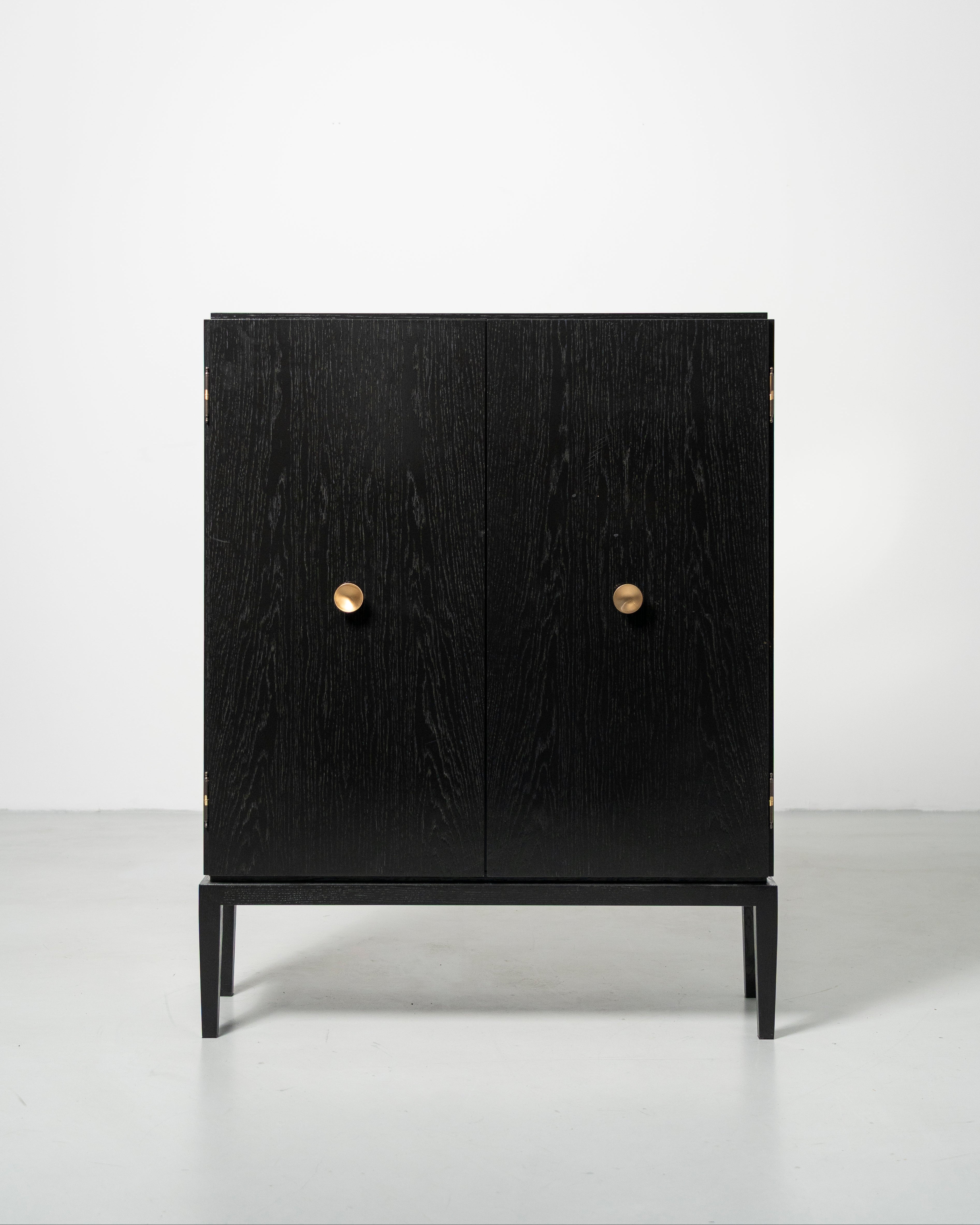 PH Display Cabinet by Poul Henningsen, Danish design classic (1930s)
black oak cabinet with wood doors and brass handles
