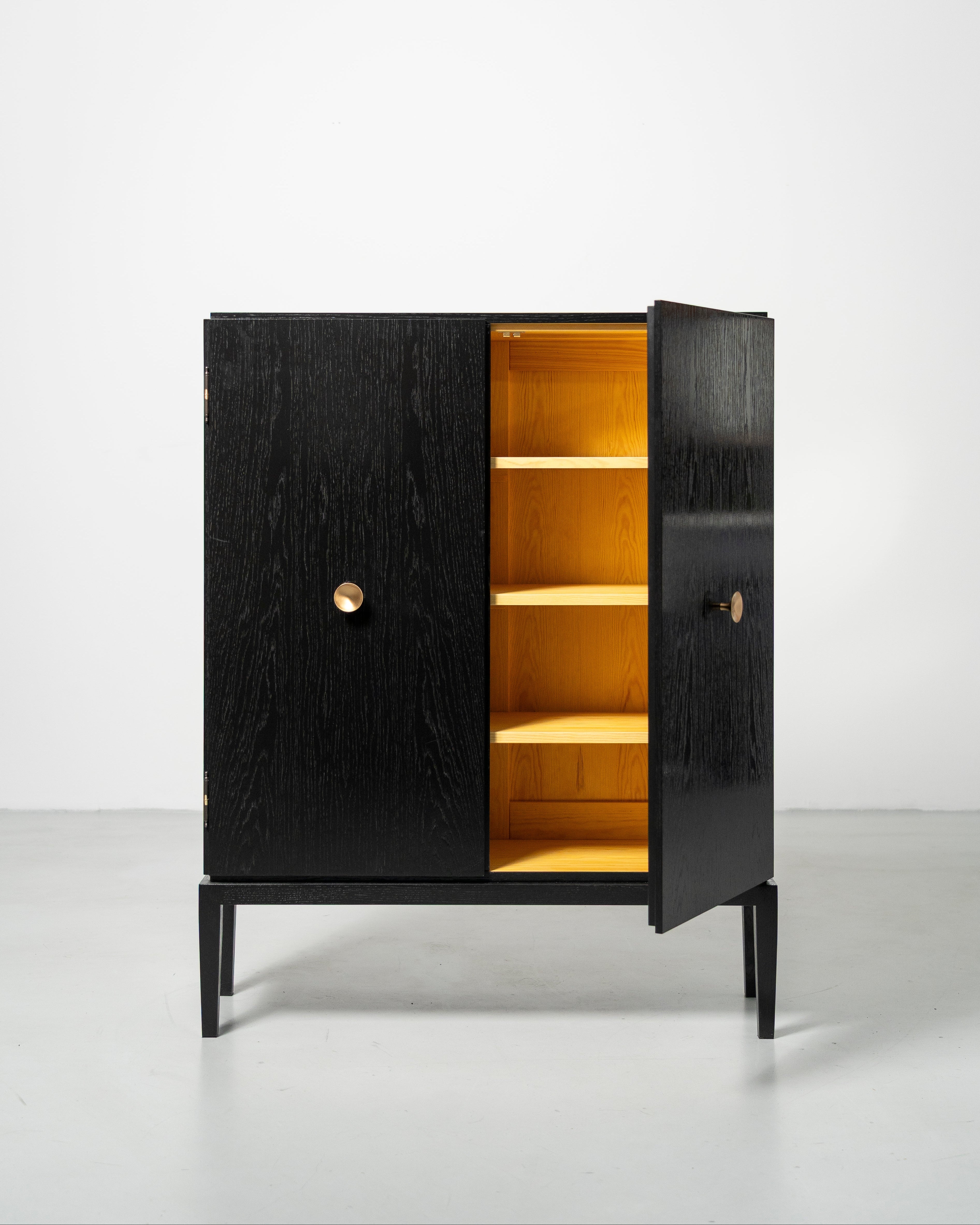 PH Display Cabinet by Poul Henningsen, Danish design classic (1930s)
black oak cabinet with wood doors and brass handles