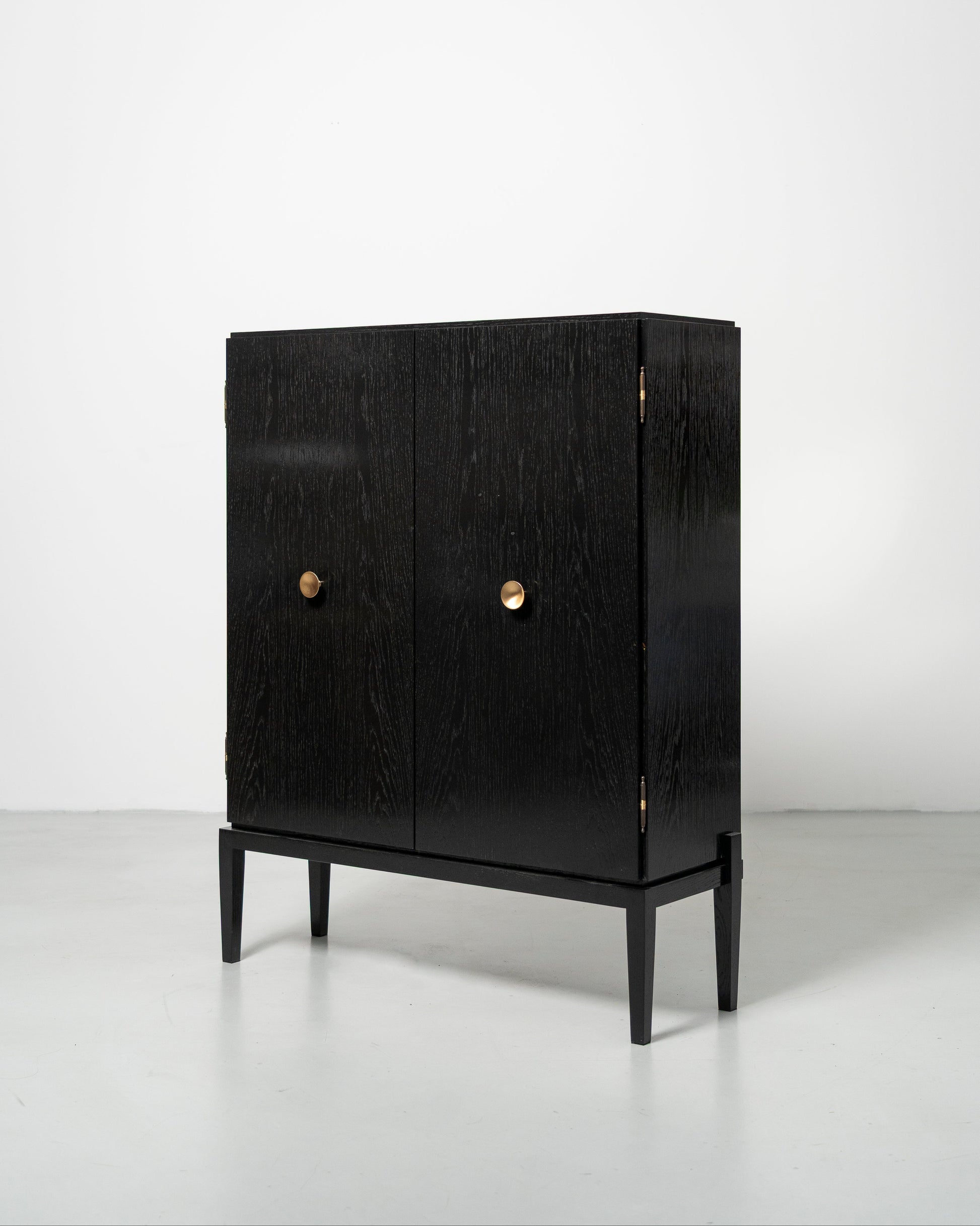PH Display Cabinet by Poul Henningsen, Danish design classic (1930s)
black oak cabinet with wood doors and brass handles