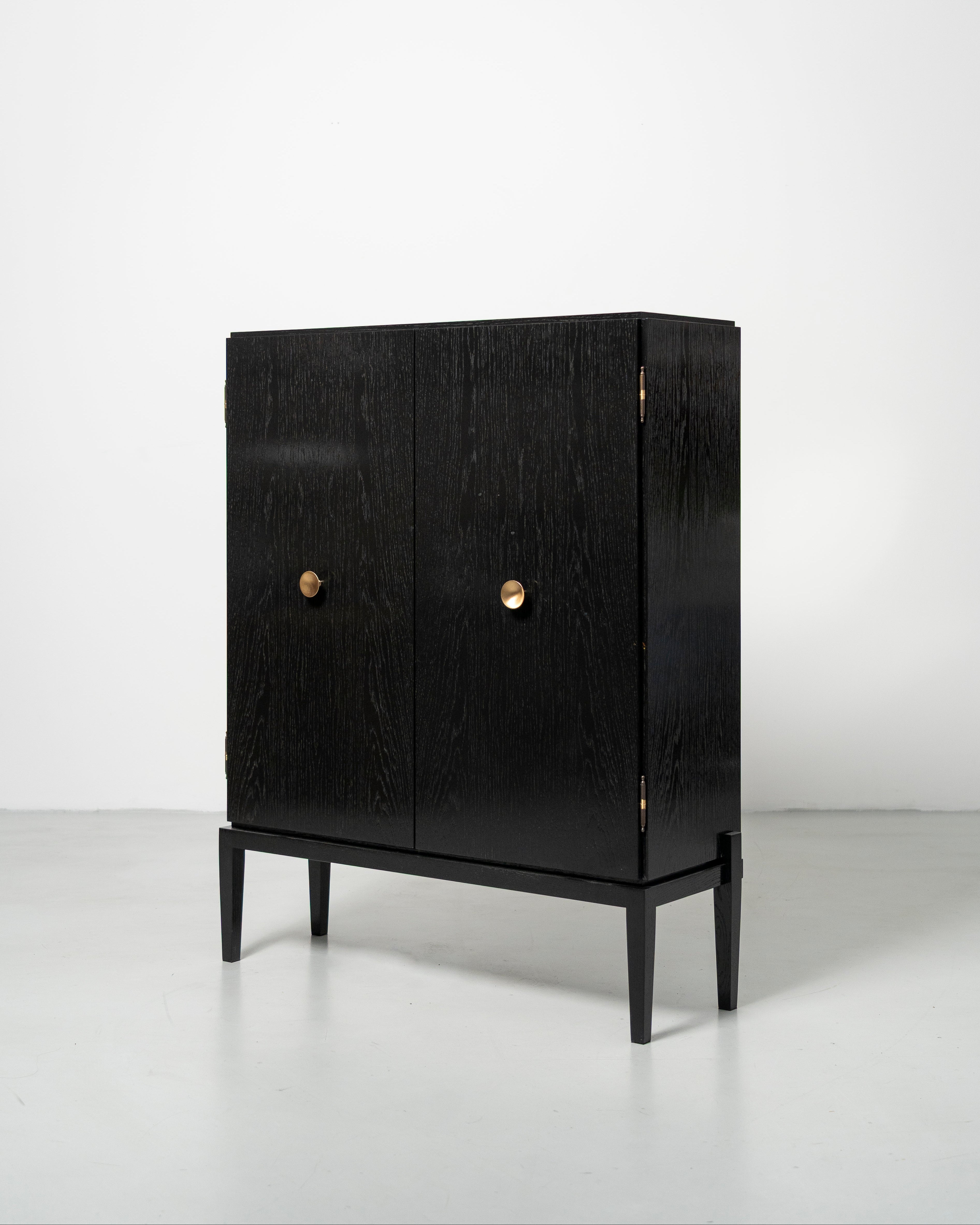 PH Display Cabinet by Poul Henningsen, Danish design classic (1930s)
black oak cabinet with wood doors and brass handles