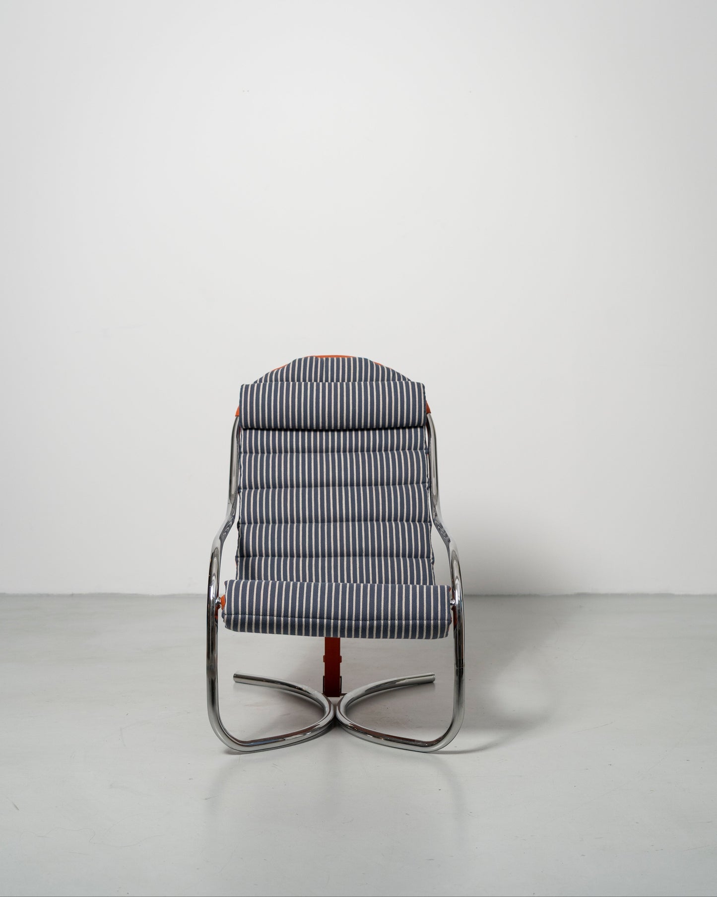 A wool fabric upholstered PH lounge chair with a chromed steel tube frame, designed by Poul Henningsen.