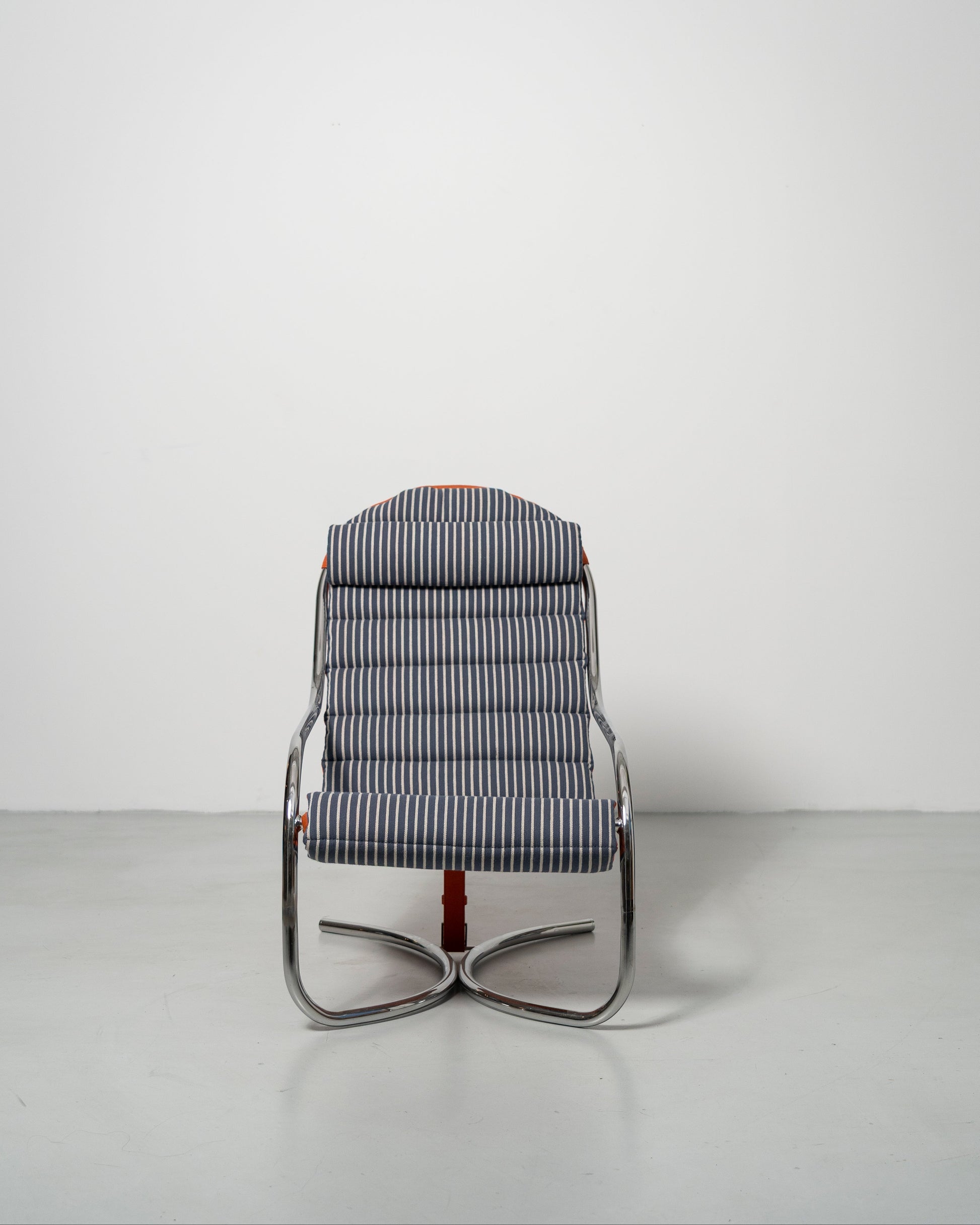 A wool fabric upholstered PH lounge chair with a chromed steel tube frame, designed by Poul Henningsen.