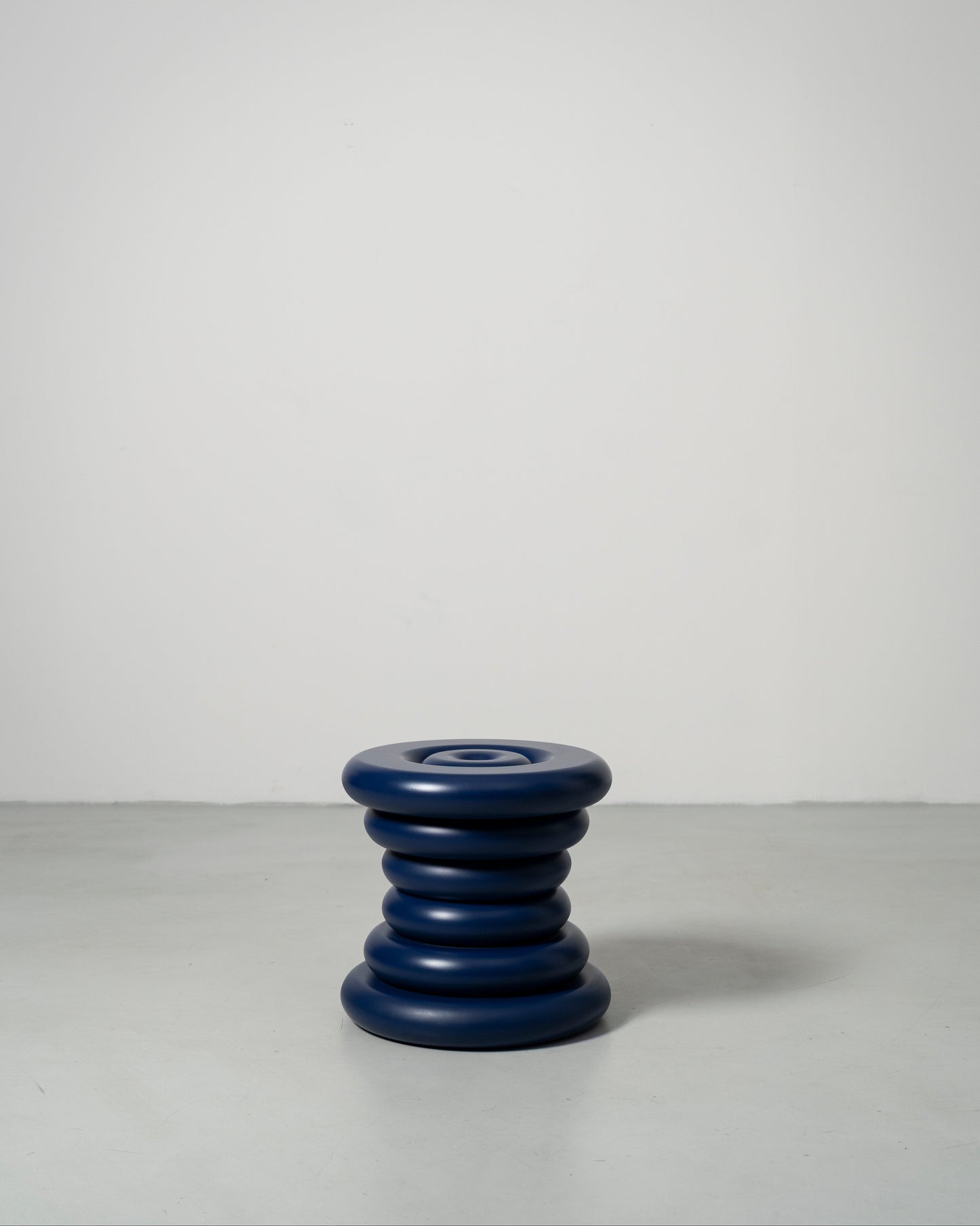 Spine Stool designed by Caisa Leifsdotter sculptural blue painted solid oak stool that also works as a compact side table