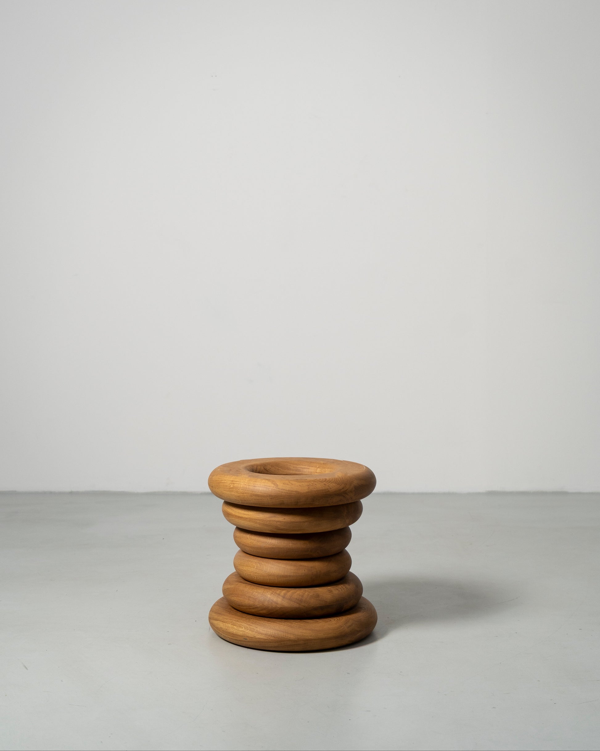 Spine Stool designed by Caisa Leifsdotter sculptural solid oak stool that also works as a compact side table