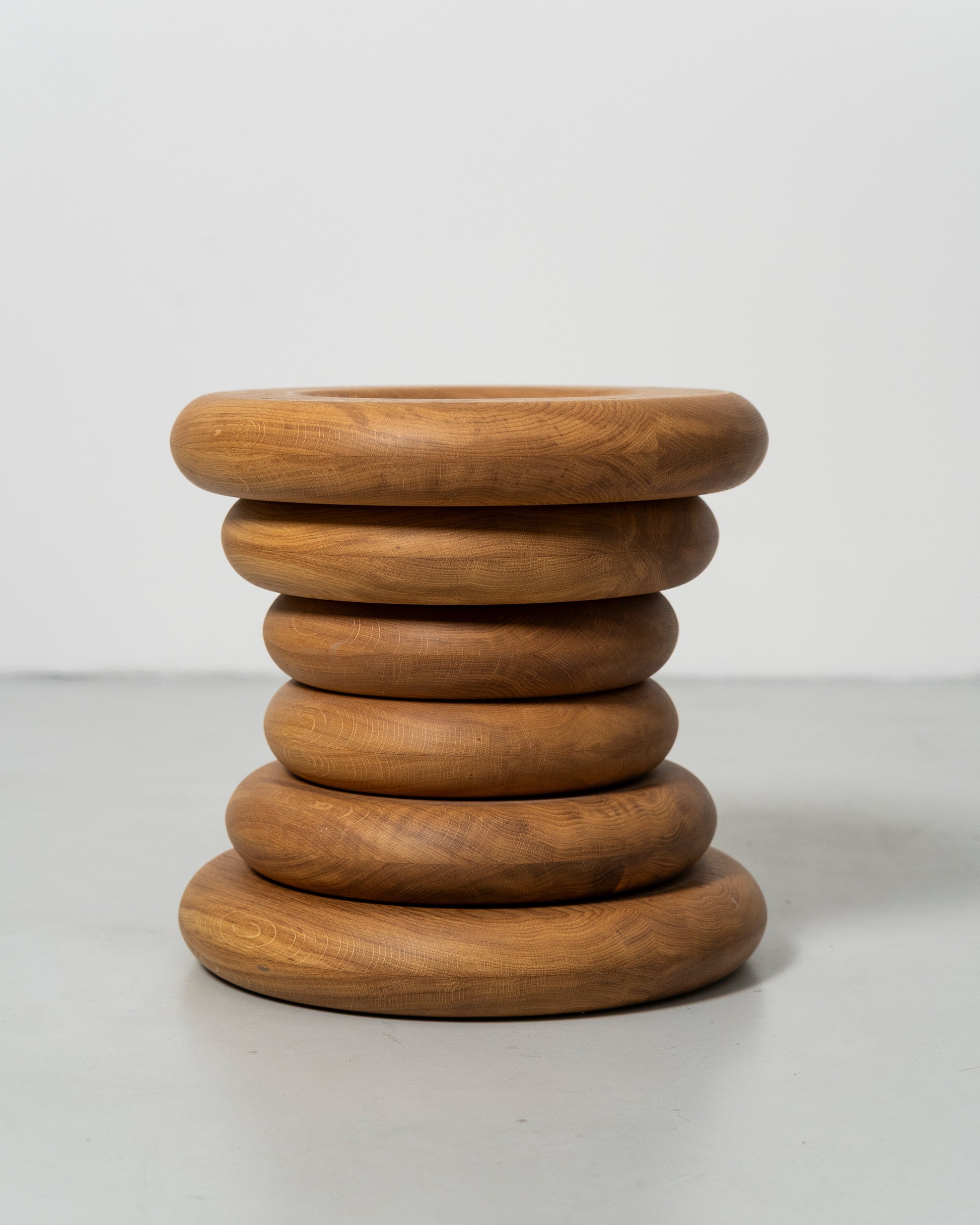 Spine Stool designed by Caisa Leifsdotter sculptural solid oak stool that also works as a compact side table