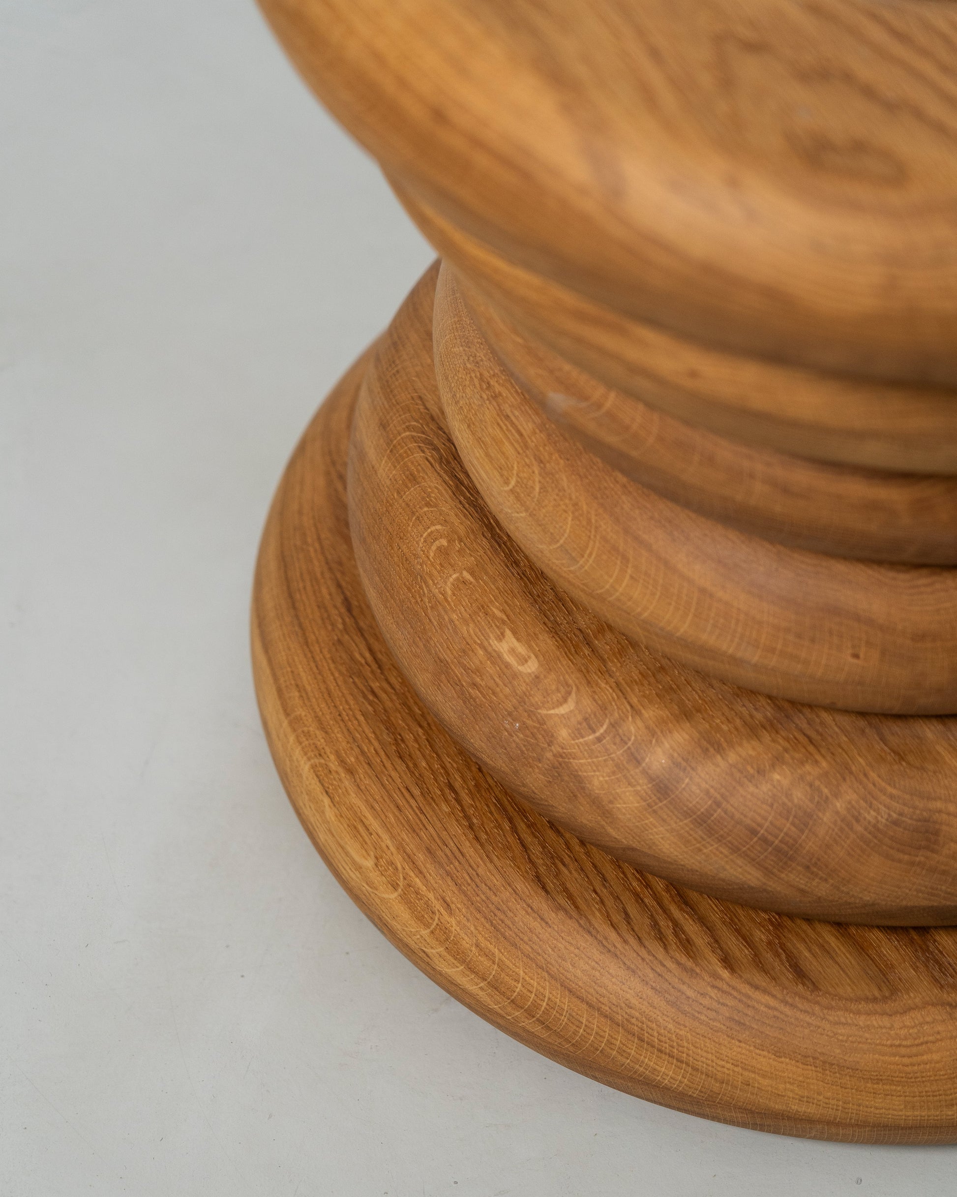 Spine Stool designed by Caisa Leifsdotter sculptural solid oak stool that also works as a compact side table