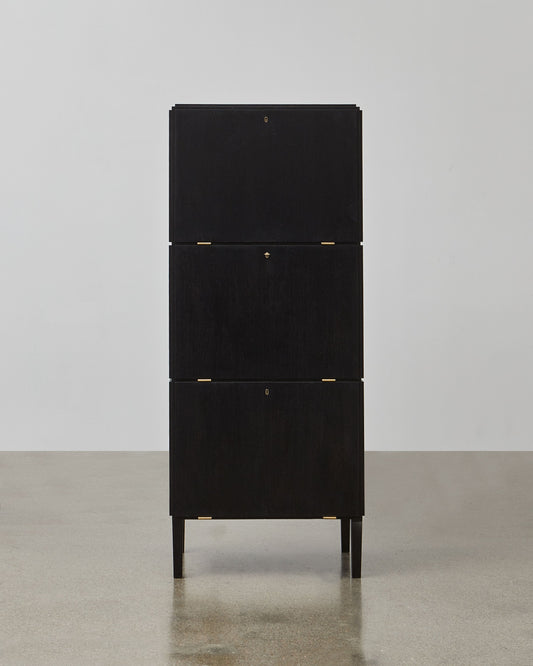PH Cabinet by Poul Henningsen, Danish design classic (1930s)
A black wooden storage cabinet with three concealed compartments and gold-colored accents.