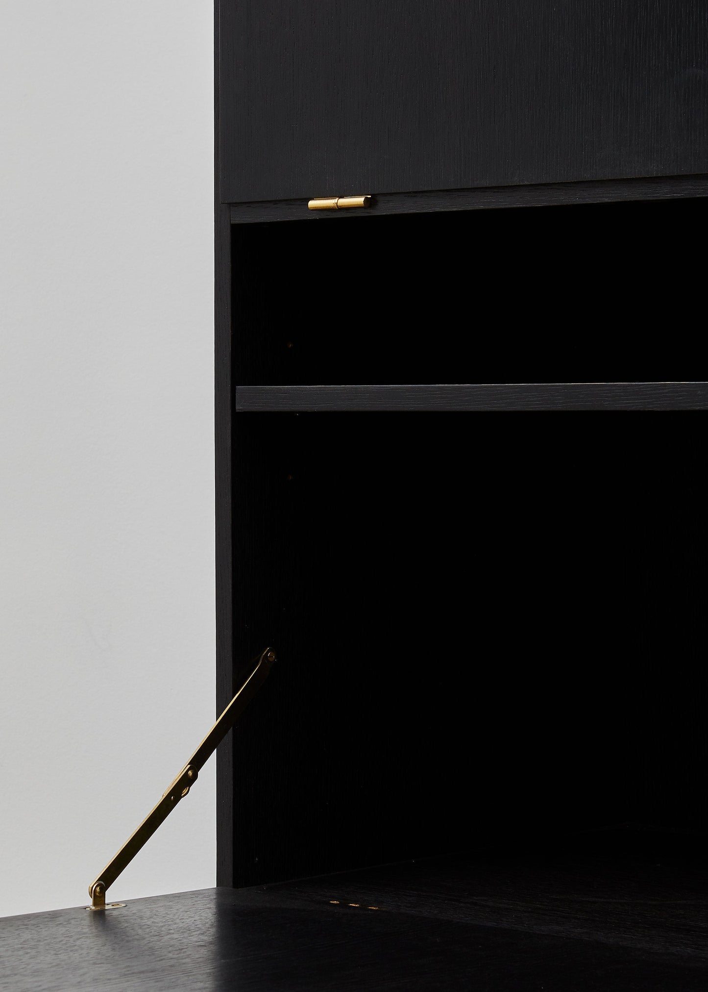 PH Cabinet by Poul Henningsen, Danish design classic (1930s)
A black wooden storage cabinet with three concealed compartments and gold-colored accents.