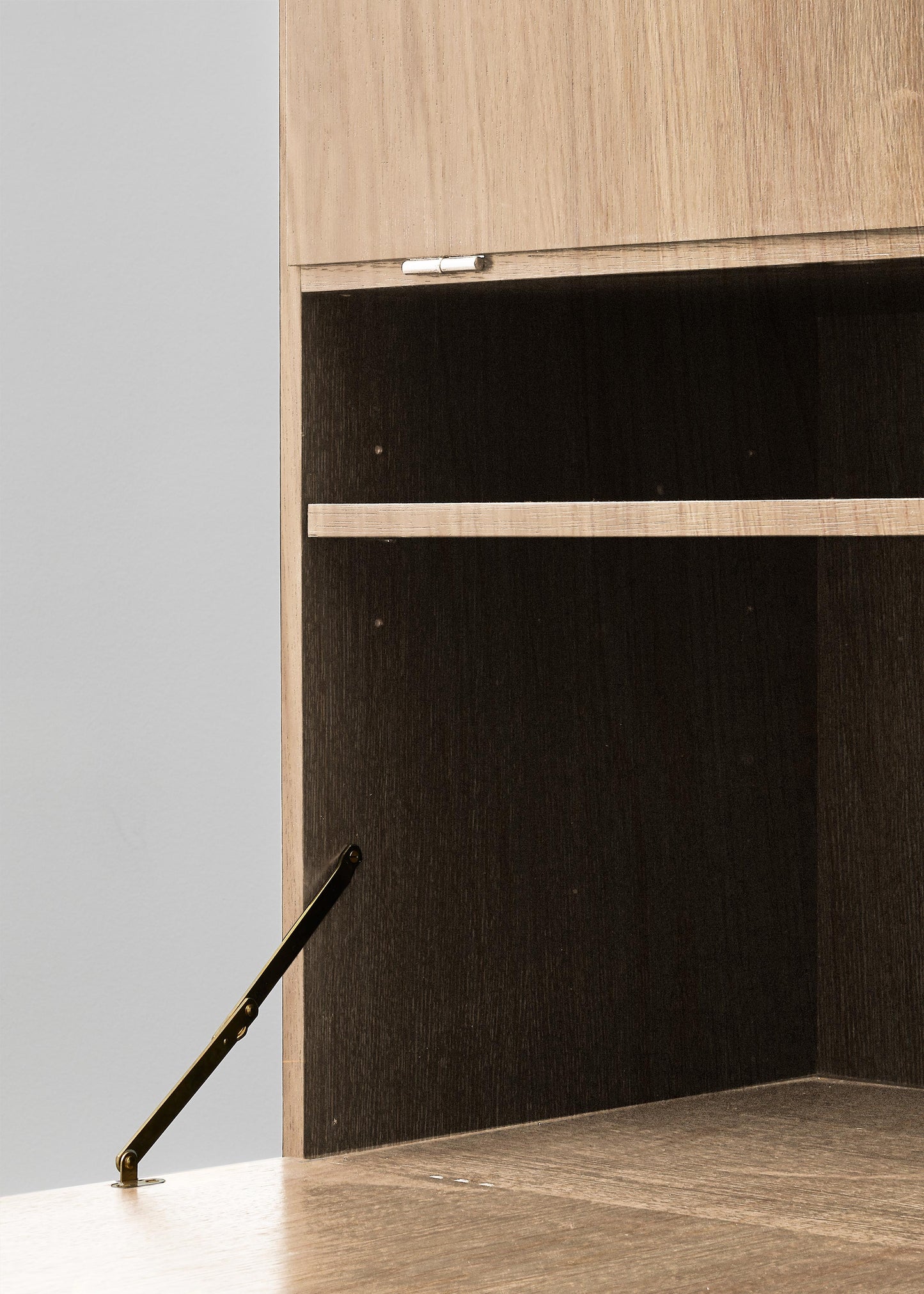 PH Cabinet by Poul Henningsen, Danish design classic (1930s)
A natural oak wooden storage cabinet with three concealed compartments and gold-colored accents.